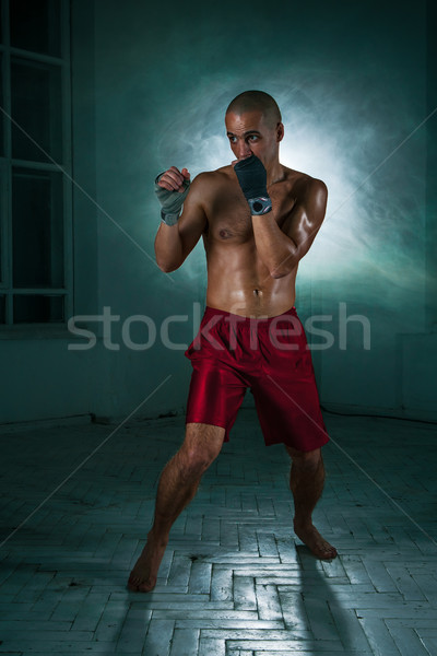 Junger Mann Kickboxen blau Rauch jungen männlich Stock foto © master1305