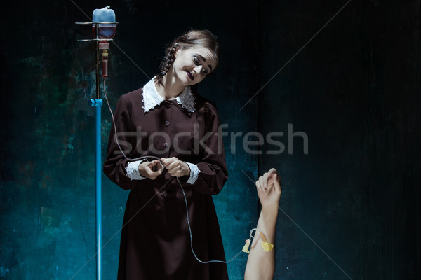 Portré fiatal lány iskolai egyenruha gyilkos nő portré kés Stock fotó © master1305