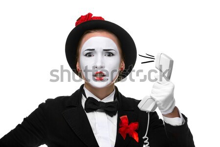 Woman in the image mime holding a handset.  Stock photo © master1305
