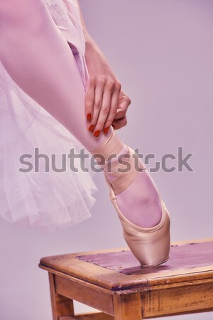 Professional ballerina putting on her ballet shoes. Stock photo © master1305