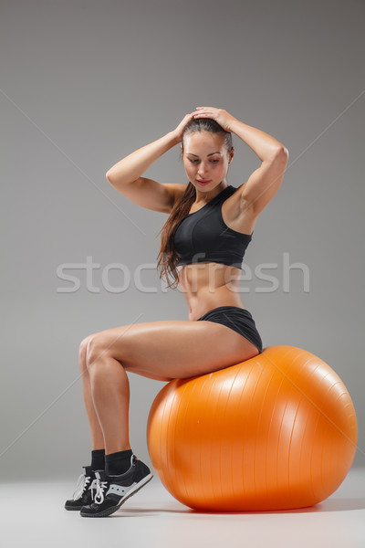 The young, beautiful, sports girl doing exercises on a fitball  Stock photo © master1305