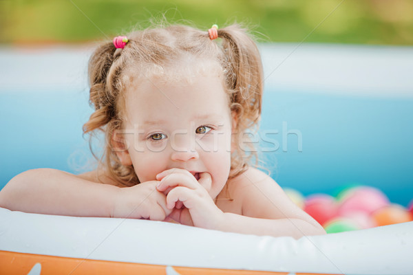 Kicsi kislány játszik játékok felfújható medence Stock fotó © master1305