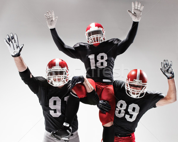 The three american football players posing on white background Stock photo © master1305