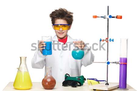 Little boy as chemist doing experiment with chemical fluid  Stock photo © master1305