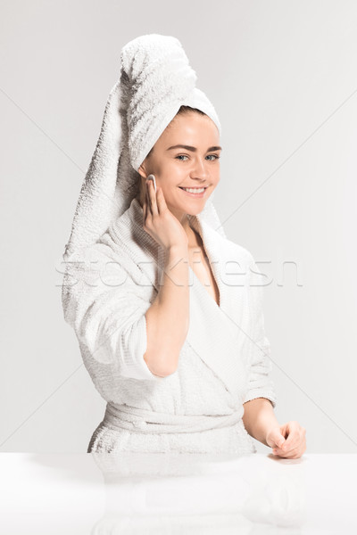 Woman cleaning face in bathroom Stock photo © master1305