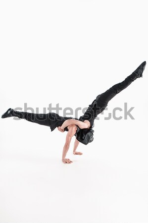 Break dancer doing handstand against  white background Stock photo © master1305