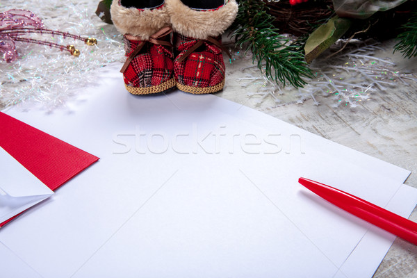 Stock photo: The blank sheet of paper on the wooden table with a pen 