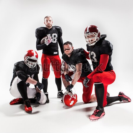 The five american football players posing with ball on white background Stock photo © master1305