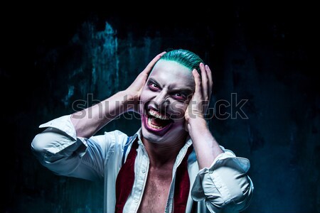 Bloody Halloween theme: crazy killer as butcher with a knife Stock photo © master1305