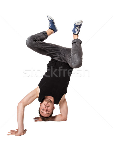 Break dancer doing one handed handstand against a white background Stock photo © master1305