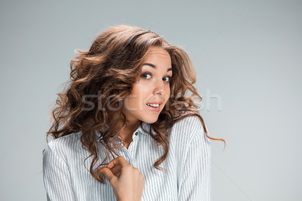 The astonished woman on gray background Stock photo © master1305