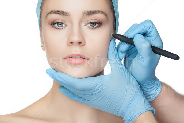 Belle jeune femme chirurgie esthétique opération toucher visage de femme Photo stock © master1305