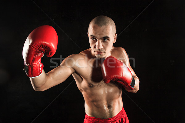 Młody człowiek kickboxing czarny młodych mężczyzna sportowiec Zdjęcia stock © master1305
