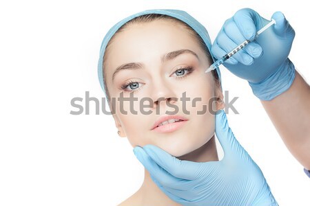 Mulher atraente cirurgia plástica seringa cara branco mão Foto stock © master1305