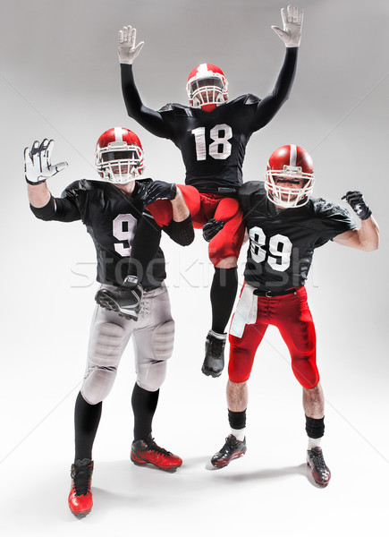 Három amerikai futball játékosok pózol fehér Stock fotó © master1305
