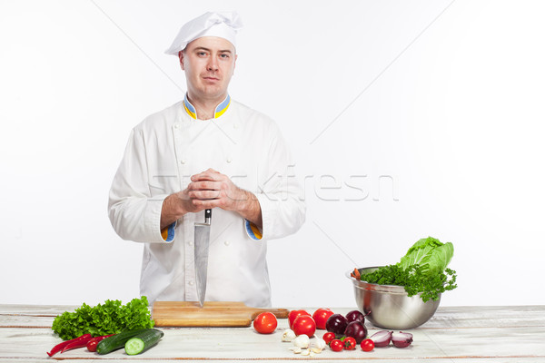 Chef posing with knife in his kitchen Stock photo © master1305