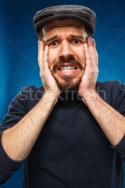 Düh sikít férfi portré fiatalember sapka Stock fotó © master1305