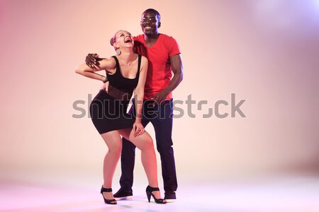 Young couple dances social Caribbean Salsa, studio shot  Stock photo © master1305