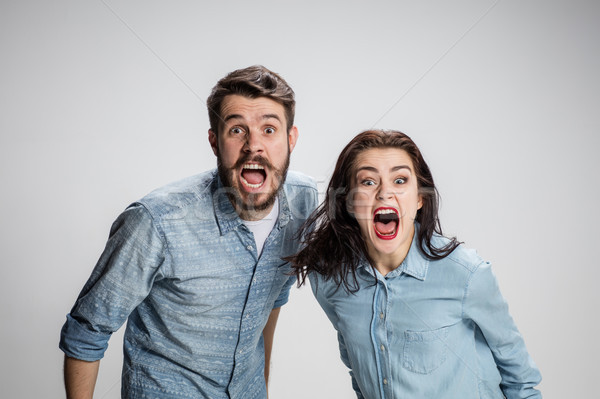 The screaming man and woman on gray Stock photo © master1305