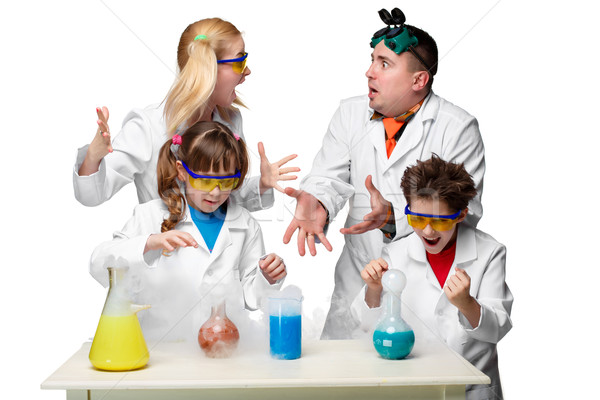 Teens and teachers of chemistry at  lesson making experiments Stock photo © master1305