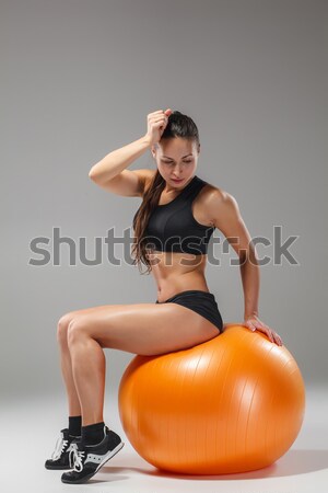 The young, beautiful, sports girl doing exercises on a fitball  Stock photo © master1305