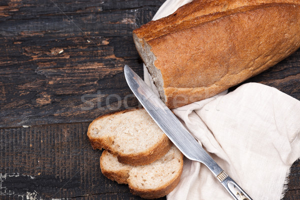 Rustic bread on wood table. Dark woody background with free text space. Stock photo © master1305
