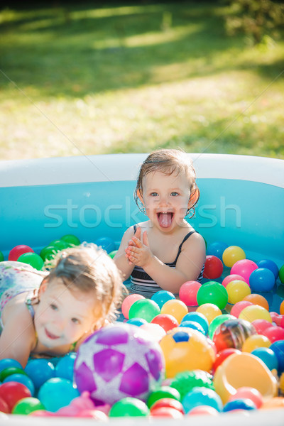 Kettő kicsi lánycsecsemők játszik játékok felfújható Stock fotó © master1305