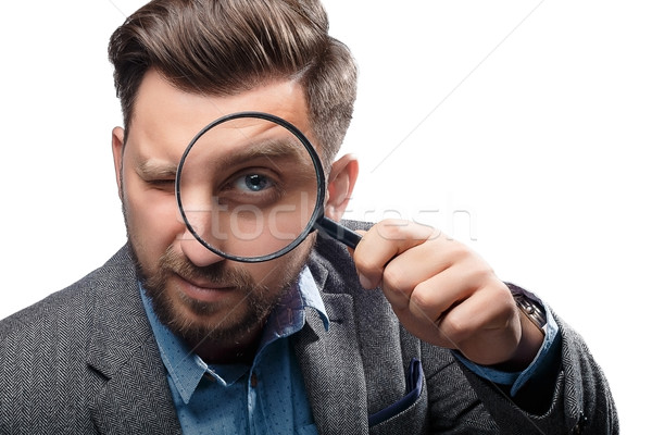 Man with magnifying glass on white background Stock photo © master1305