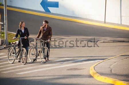 Young couple with a bicycle opposite city  Stock photo © master1305
