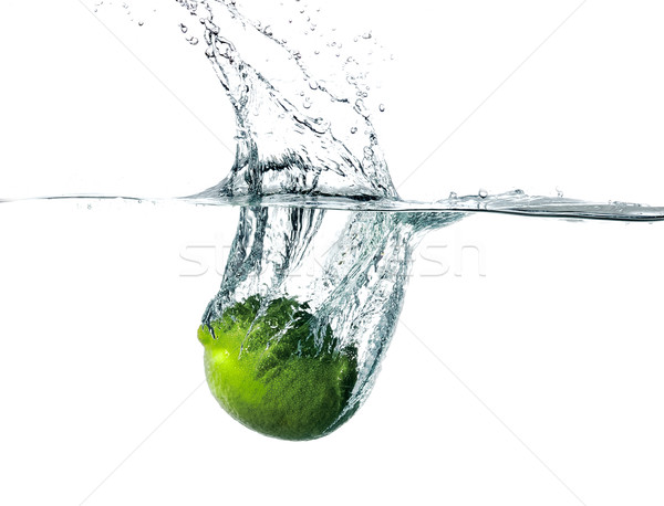 Fresh lime falling into water Stock photo © master1305