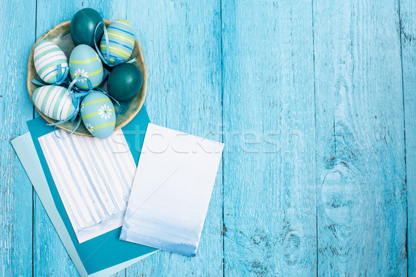 Stock photo: Easter eggs on wooden background