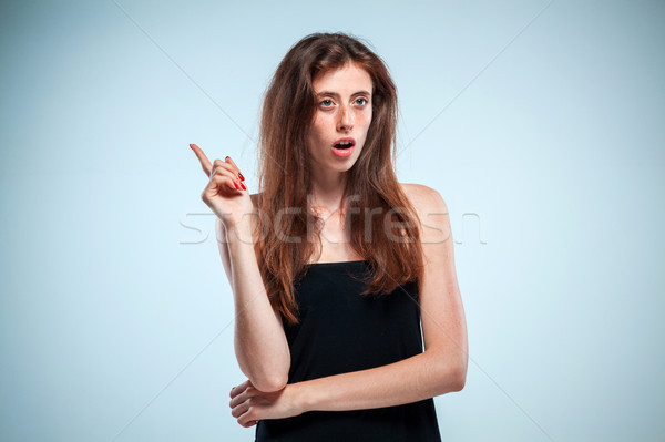 Portrait of young woman with shocked facial expression Stock photo © master1305