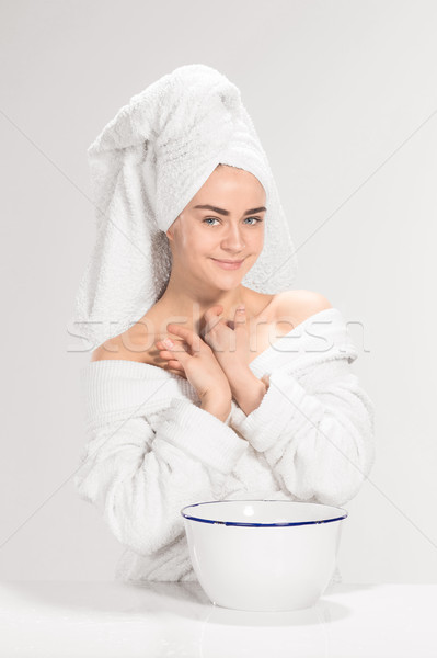 Young woman washing face with clean water Stock photo © master1305