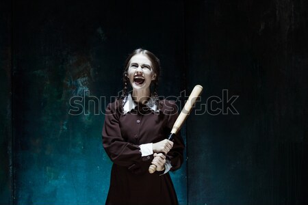 Bloody Halloween theme: crazy girl with a knife and raw meat Stock photo © master1305