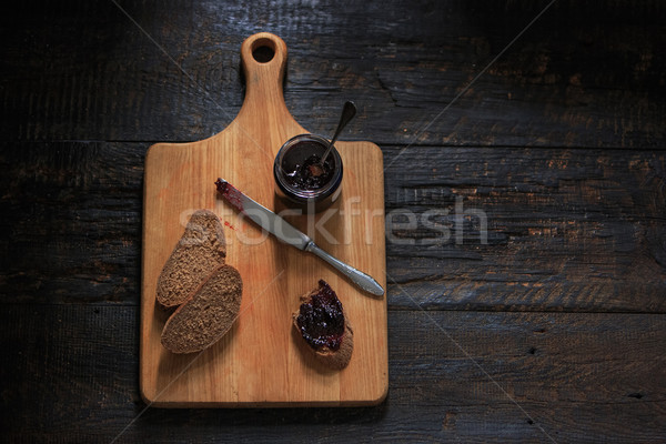 Stock photo: The top view of fruity jam on black wooden table