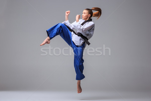 Stock photo: The karate girl with black belt 