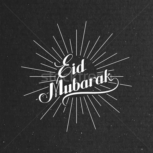handwritten Eid Mubarak retro label with light rays. Stock photo © maximmmmum