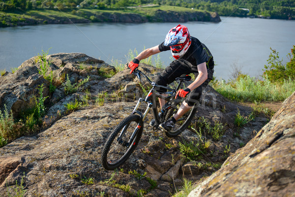 Professional Cyclist Riding the Bike on the Beautiful Spring Mountain Trail. Extreme Sports Stock photo © maxpro