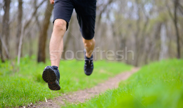 Young Sportsman Running on the Spring Forest Trail in Morning. Legs Close up View Stock photo © maxpro