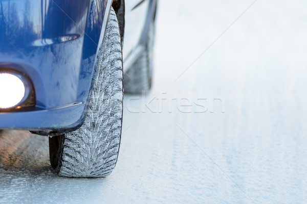 Blue Car with Winter Tires on the Snowy Road. Drive Safe. Stock photo © maxpro