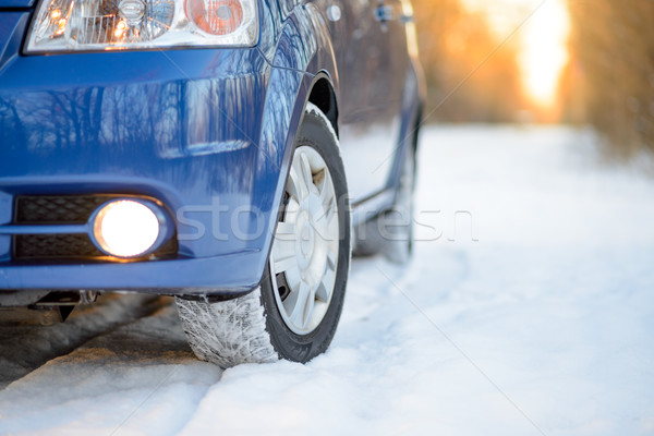 Blue Car with Winter Tires on the Snowy Road. Drive Safe. Stock photo © maxpro