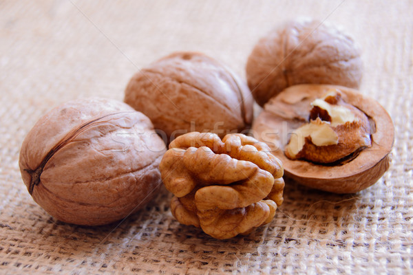 Mature walnuts on woven fabric Stock photo © maxpro