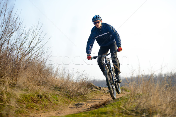 Enduro Cyclist Riding the Mountain Bike Down Beautiful Rocky Trail. Extreme Sport Concept. Space for Stock photo © maxpro