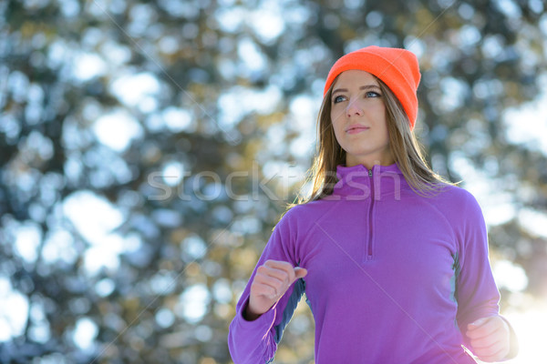 Young Woman Running in Beautiful Winter Forest at Sunny Frosty Day. Active Lifestyle Concept. Stock photo © maxpro
