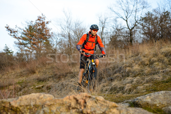 Enduro Cyclist Riding the Mountain Bike on the Rocky Trail. Extreme Sport Concept. Space for Text. Stock photo © maxpro