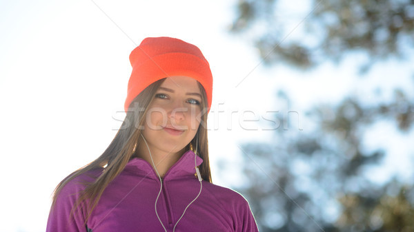 Young Woman Runner Smiling in Beautiful Winter Forest at Sunny Frosty Day. Active Lifestyle and Spor Stock photo © maxpro