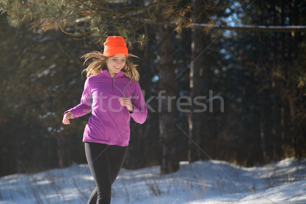 Fiatal nő fut gyönyörű tél erdő napos Stock fotó © maxpro