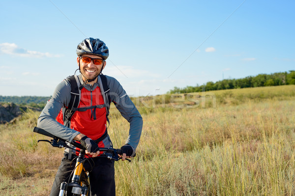 Stock photo: Portrait of Young Cyclist in Helmet and Glasses