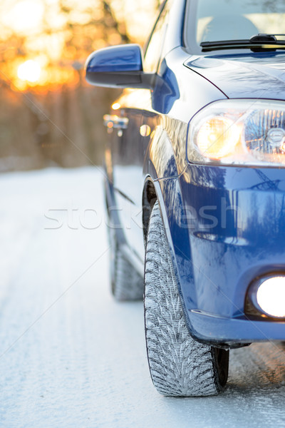 Blue Car with Winter Tires on the Snowy Road. Drive Safe. Stock photo © maxpro