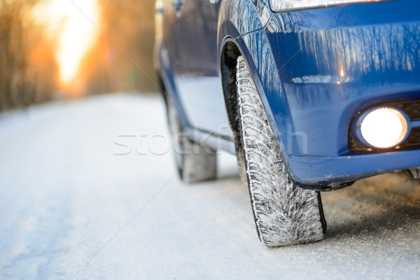 Blue Car with Winter Tires on the Snowy Road. Drive Safe. Stock photo © maxpro